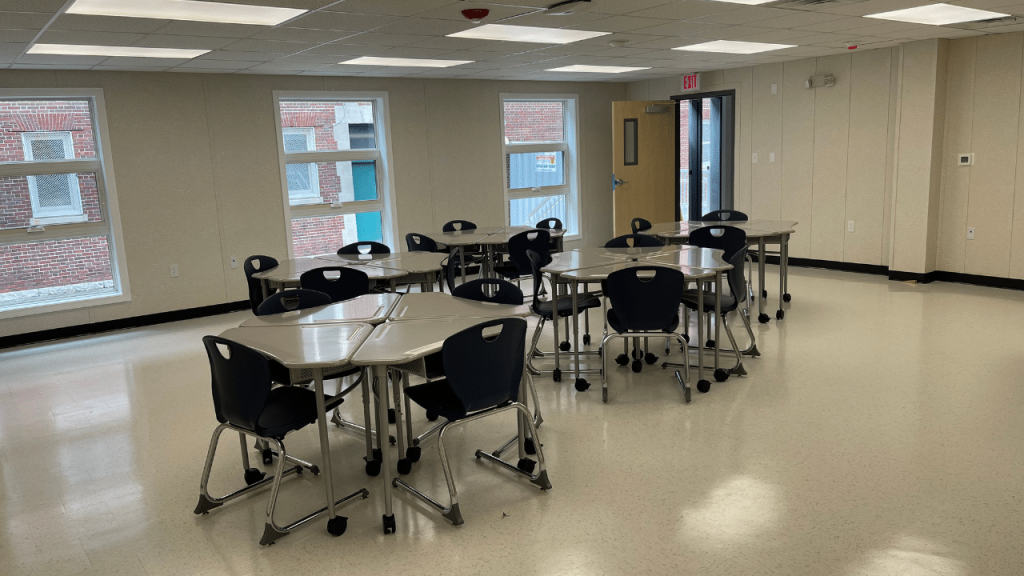 Classroom setting featuring modular tables and chairs in a triumph modular building designed for flexible learning environments.