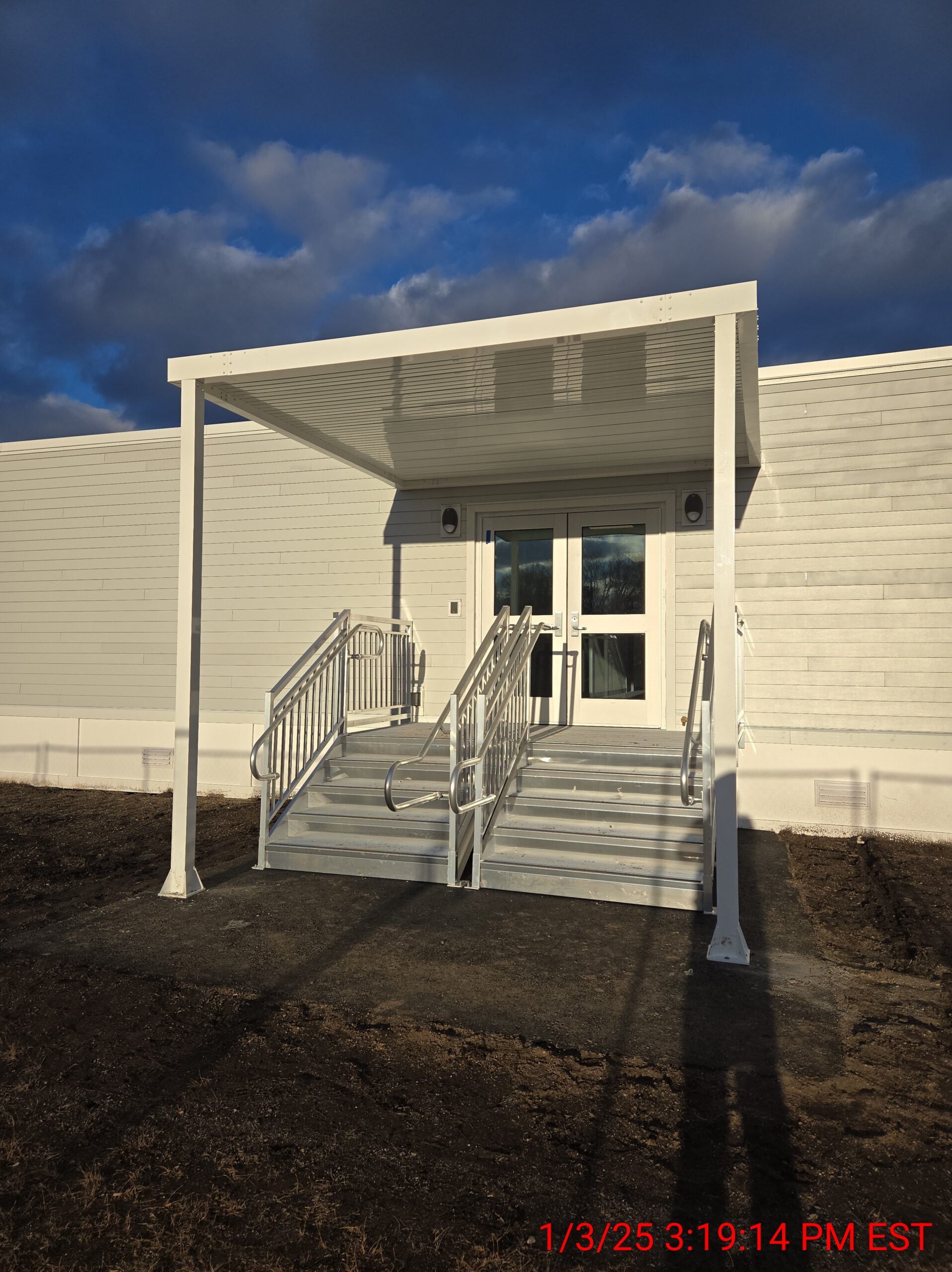 School building exterior entrance with stairs