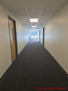Interior image of the buildings carpeted hallway