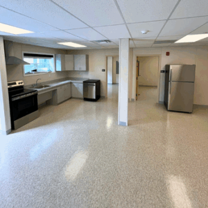 Modular kitchen with stove, dishwasher, and refrigerator.
